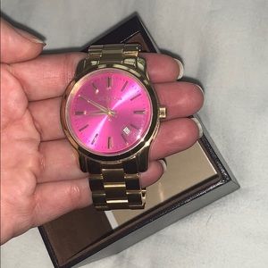 Gold Michael Kors watch with pink face
